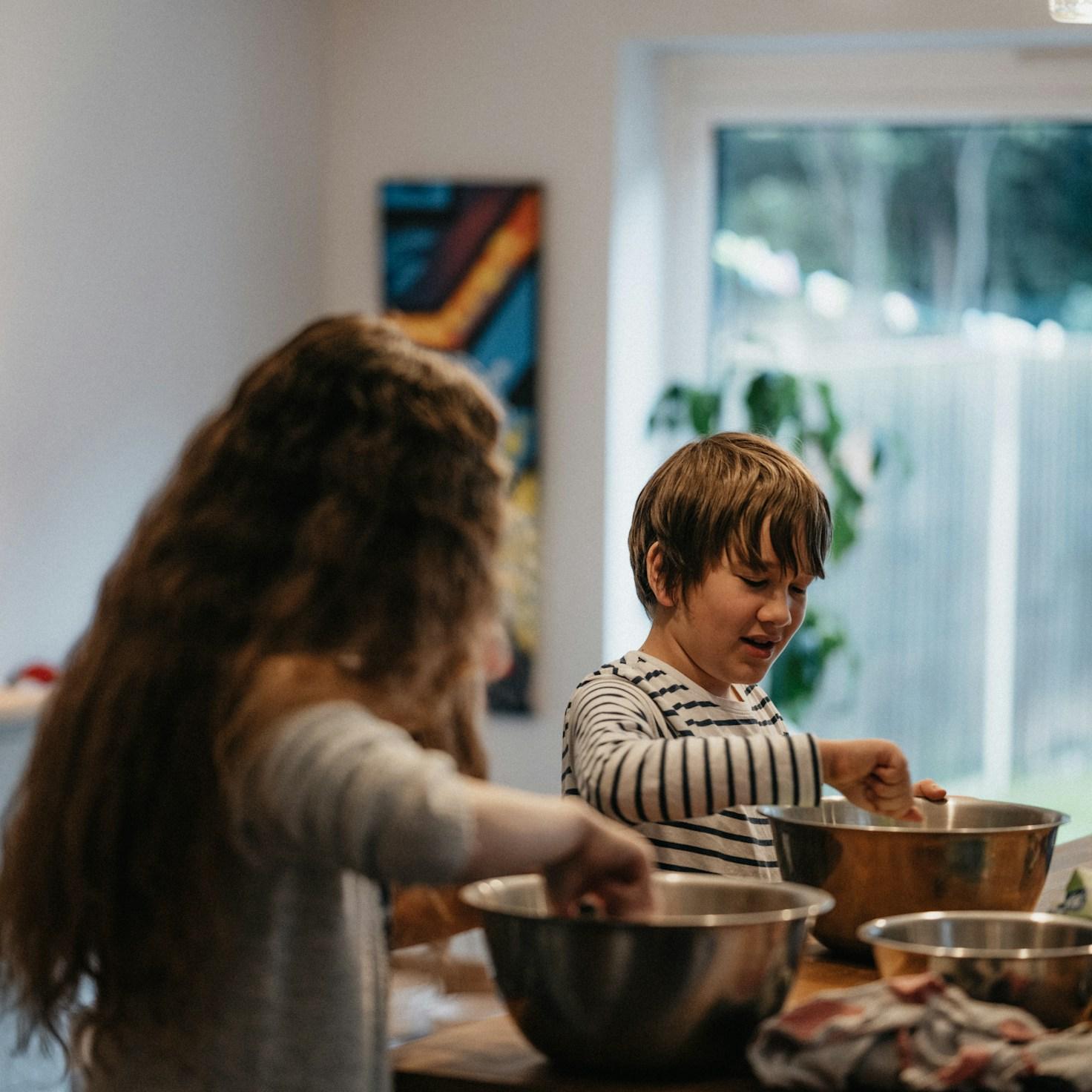Community members collaborating in a modern kitchen space, sharing recipes and cooking techniques